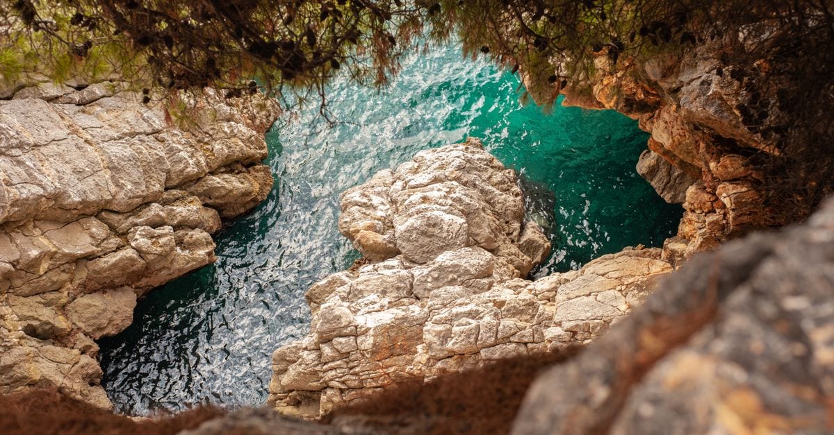 A rocky cove with clear shallow water