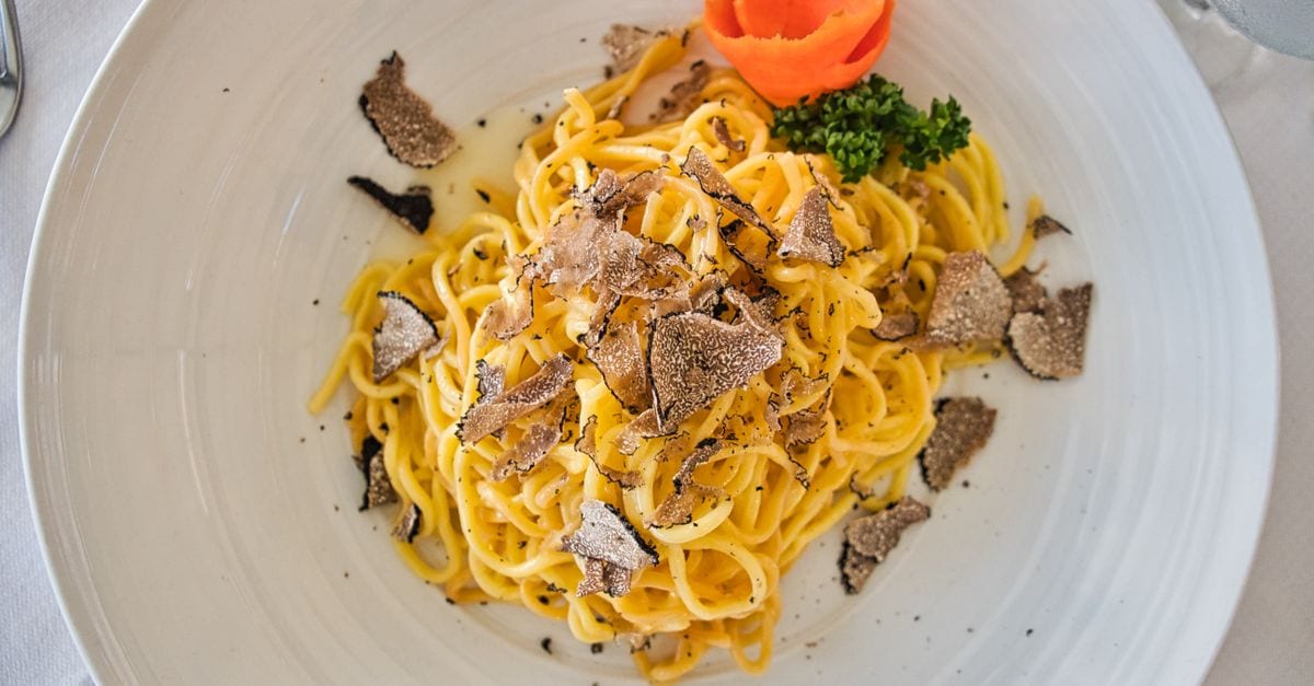 A plate of Istrian food on a wooden table